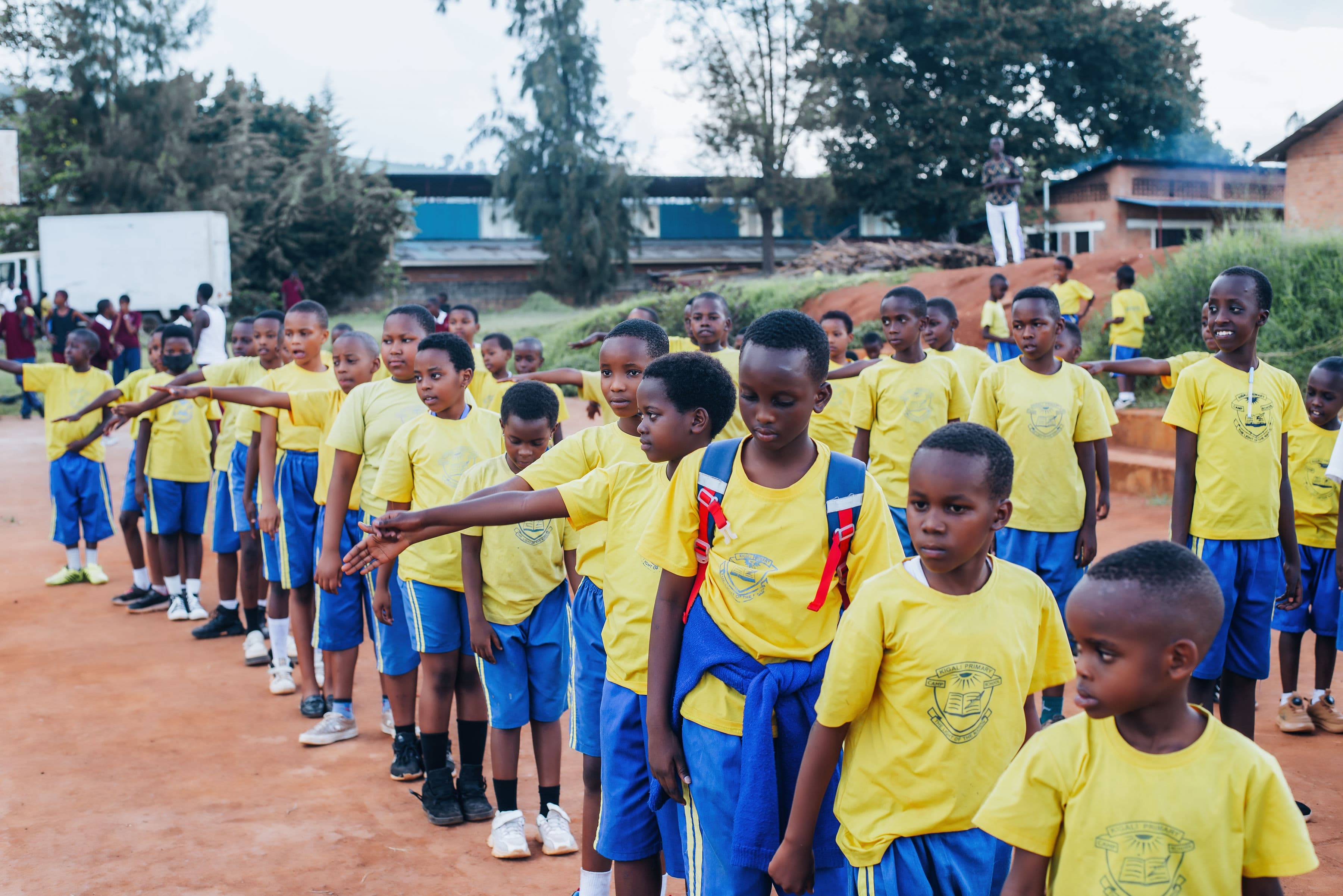 Camp Kigali students practicing fencing
